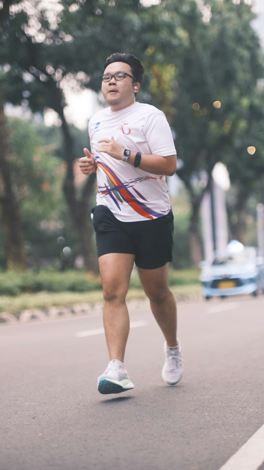 Eurasian Singaporean male cardio and performance coach with glasses